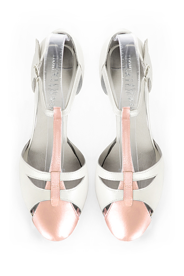 French elegance and refinement for these powder pink and pure white dress T-strap open side shoes, 
                available in many subtle leather and colour combinations. A pretty model with a comfortable "Salomé" strap and good support.
Its charming spyglass cut-out gives you plenty of scope for personalisation.  
                Matching clutches for parties, ceremonies and weddings.   
                You can customize these shoes to perfectly match your tastes or needs, and have a unique model.  
                Choice of leathers, colours, knots and heels. 
                Wide range of materials and shades carefully chosen.  
                Rich collection of flat, low, mid and high heels.  
                Small and large shoe sizes - Florence KOOIJMAN